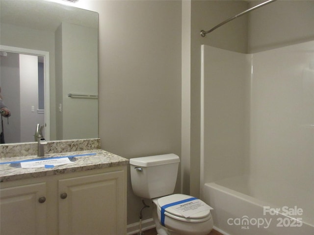 bathroom featuring toilet and vanity