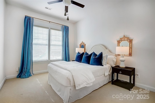 bedroom featuring carpet floors, a ceiling fan, visible vents, and baseboards