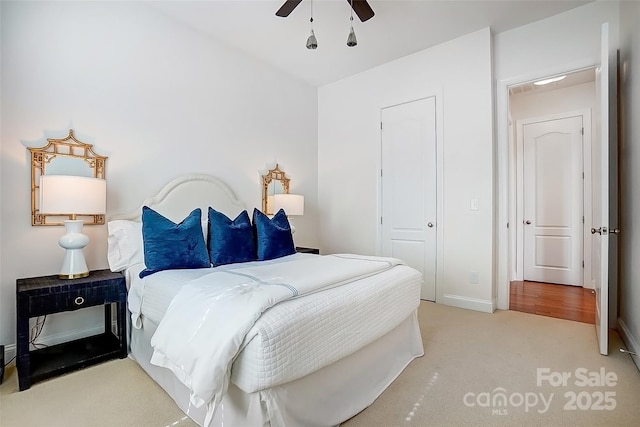 bedroom featuring carpet floors, a ceiling fan, and baseboards