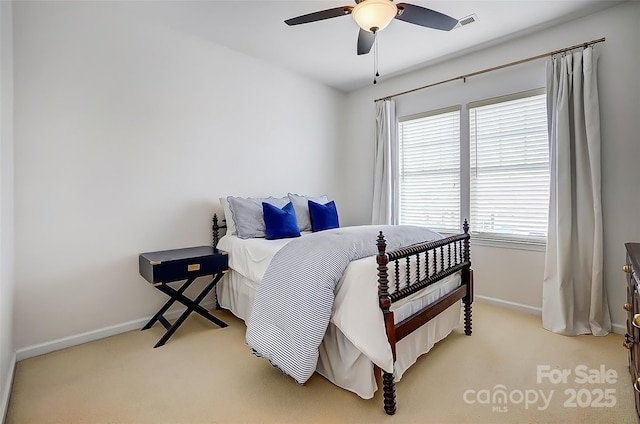 carpeted bedroom featuring visible vents, ceiling fan, and baseboards