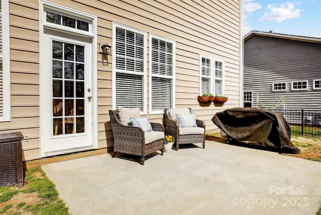 view of patio / terrace featuring fence and central AC