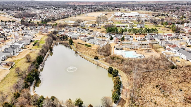 drone / aerial view featuring a water view and a residential view