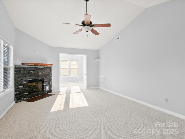 2302 Deermouse Way, Hendersonville, NC 28792 - unfurnished living room with visible vents, light colored carpet, a stone fireplace, and baseboards