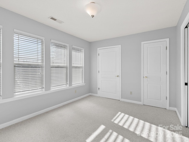 2302 Deermouse Way, Hendersonville, NC 28792 - unfurnished bedroom with light carpet, baseboards, and visible vents