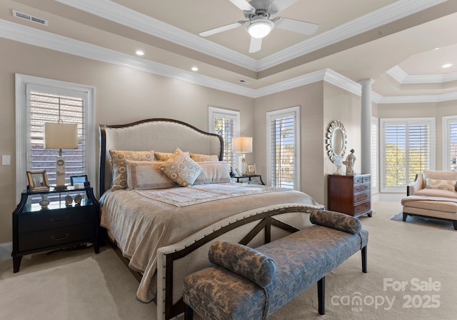 bedroom featuring light carpet, ornate columns, visible vents, and crown molding