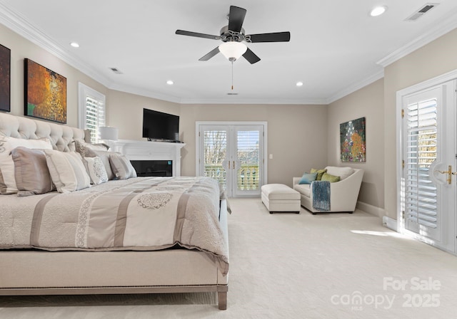 bedroom featuring light colored carpet, ornamental molding, access to outside, french doors, and multiple windows