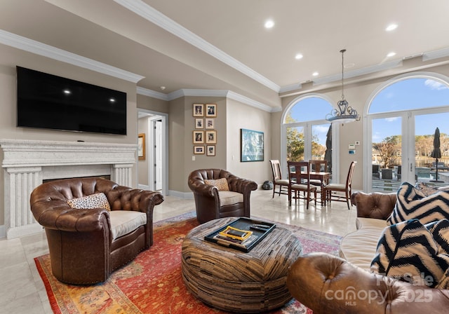 living room featuring ornamental molding, recessed lighting, a fireplace, and baseboards