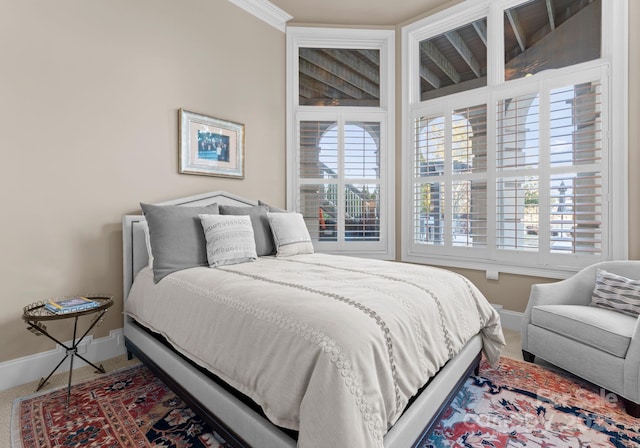 bedroom featuring carpet floors and baseboards