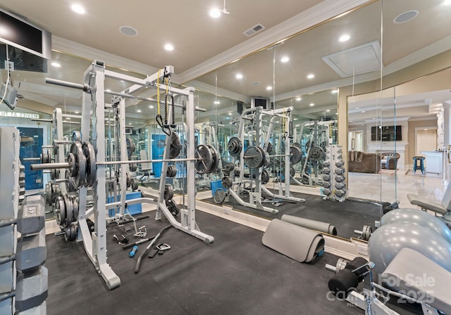 workout area with attic access, recessed lighting, visible vents, and ornamental molding