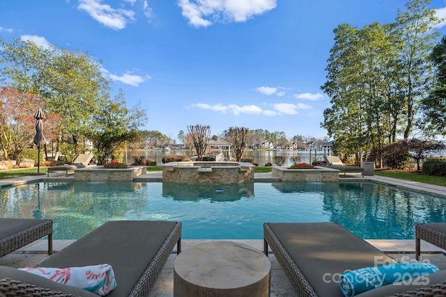 view of swimming pool featuring fence and a pool with connected hot tub