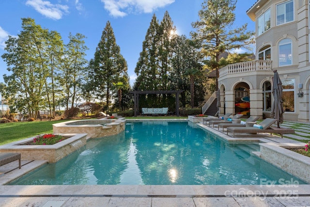 view of swimming pool featuring a patio and a pool with connected hot tub