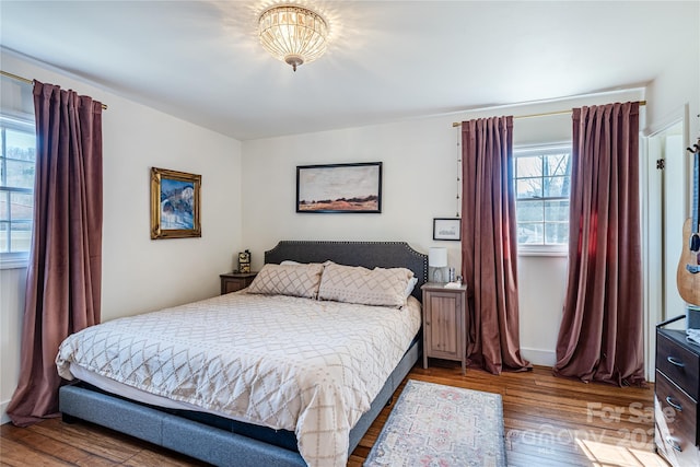 bedroom featuring wood-type flooring