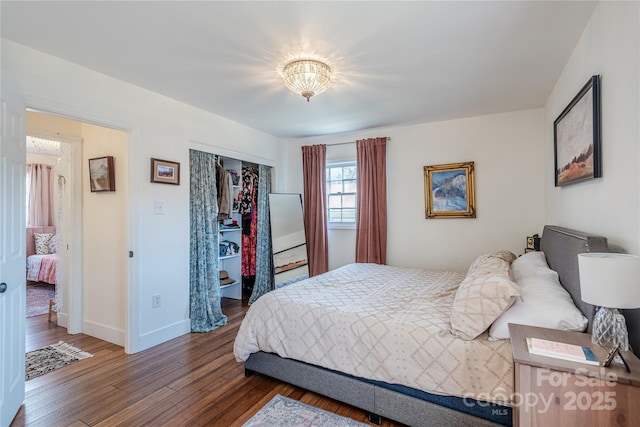 bedroom featuring a closet and dark hardwood / wood-style floors