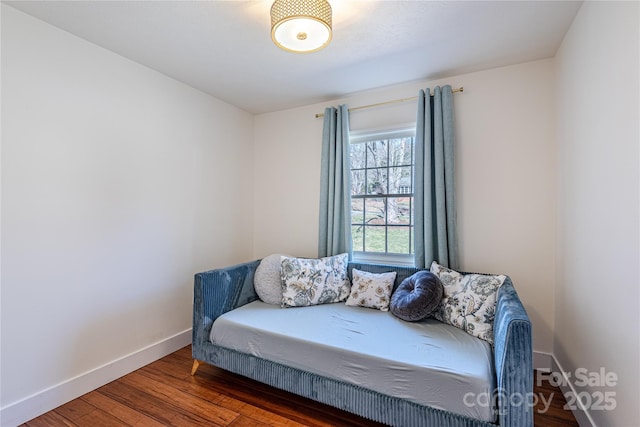 bedroom with dark wood-type flooring