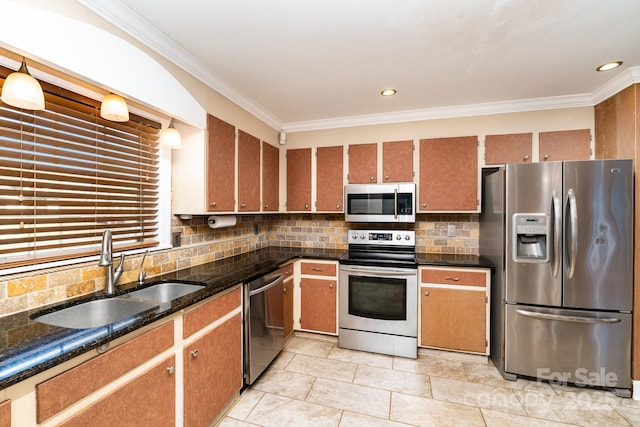 kitchen featuring sink, backsplash, crown molding, and stainless steel appliances