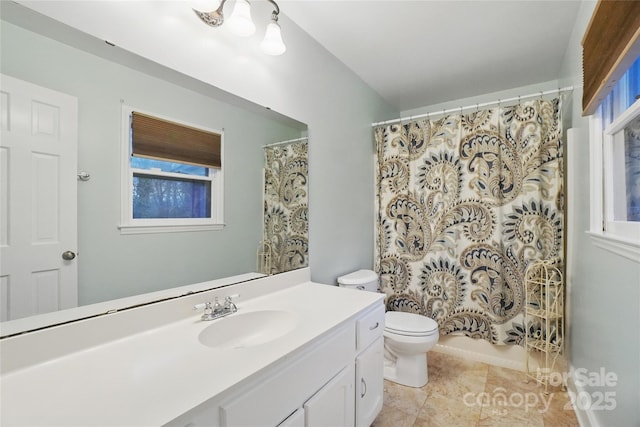 bathroom with vanity, toilet, and tile patterned flooring