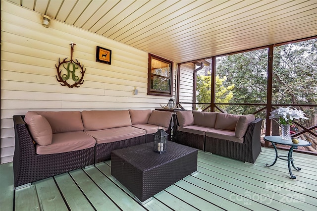 wooden terrace featuring an outdoor living space