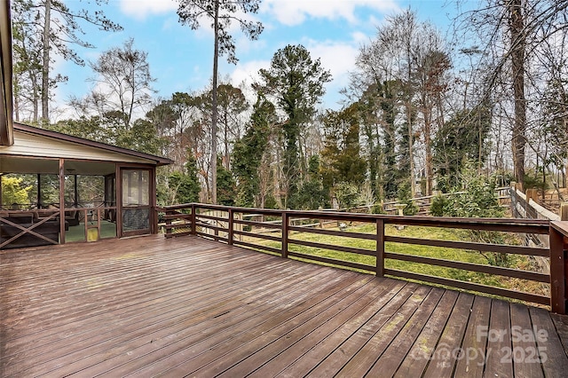 wooden terrace with a sunroom