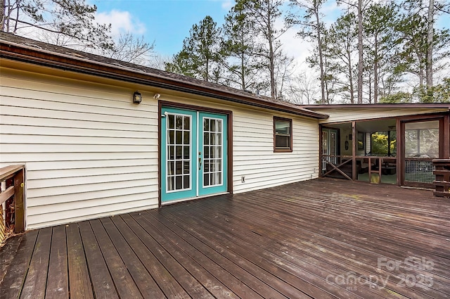 wooden deck featuring french doors