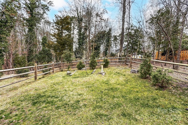 view of yard with a fenced backyard