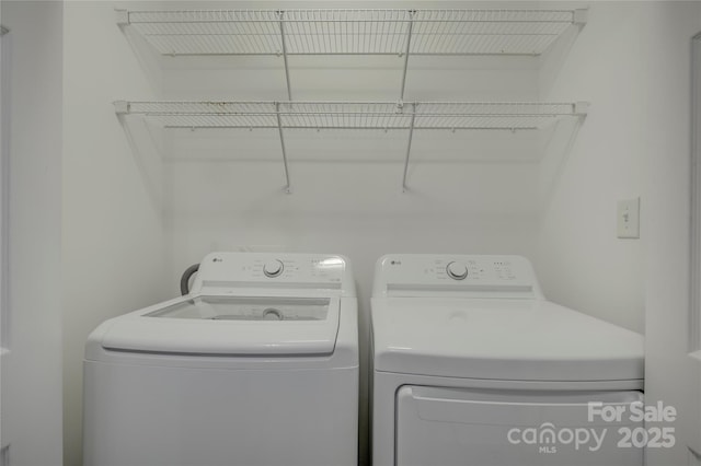 laundry area featuring laundry area and washing machine and dryer