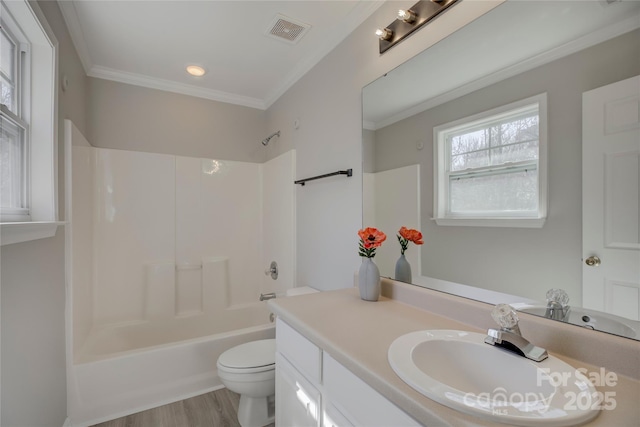 bathroom featuring shower / bathtub combination, toilet, vanity, visible vents, and crown molding