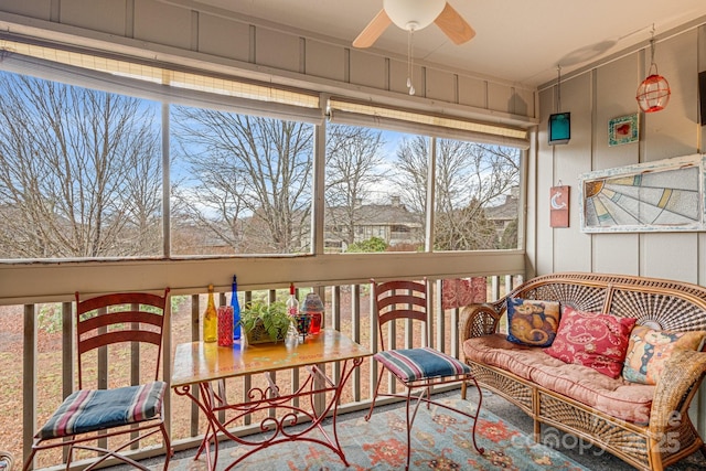 sunroom featuring ceiling fan