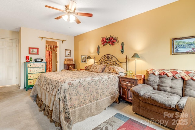 carpeted bedroom featuring ceiling fan