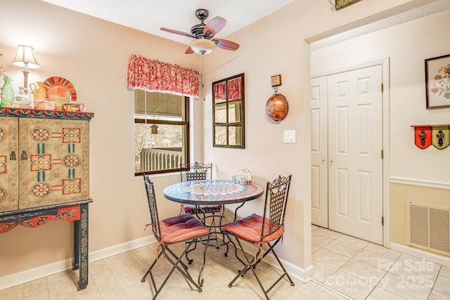 dining space featuring ceiling fan