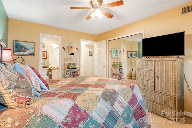 bedroom with ensuite bath, a closet, ceiling fan, and a textured ceiling