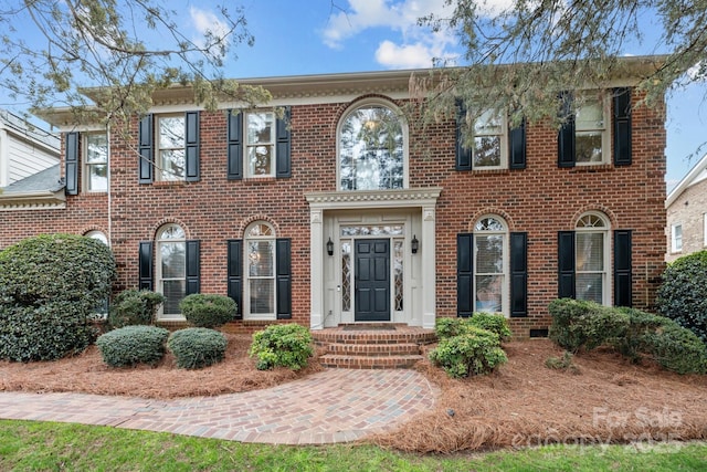 view of front facade featuring brick siding