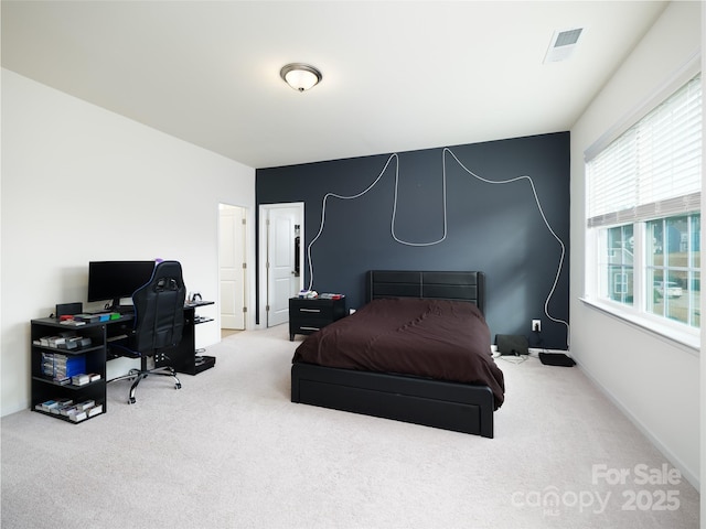 carpeted bedroom with visible vents