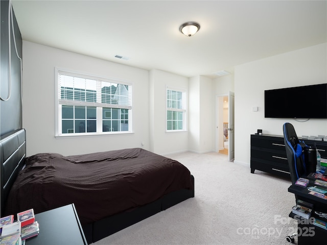 bedroom with light carpet, baseboards, and visible vents