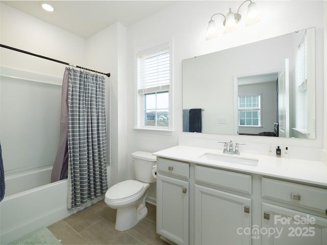 bathroom with tile patterned flooring, vanity, toilet, and shower / bath combo