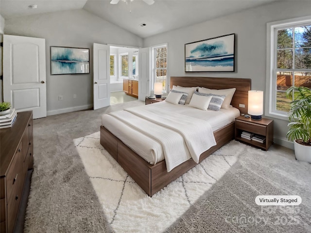 bedroom featuring light colored carpet, multiple windows, and vaulted ceiling