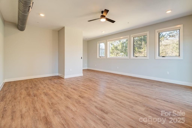 empty room with light wood-style floors, recessed lighting, ceiling fan, and baseboards