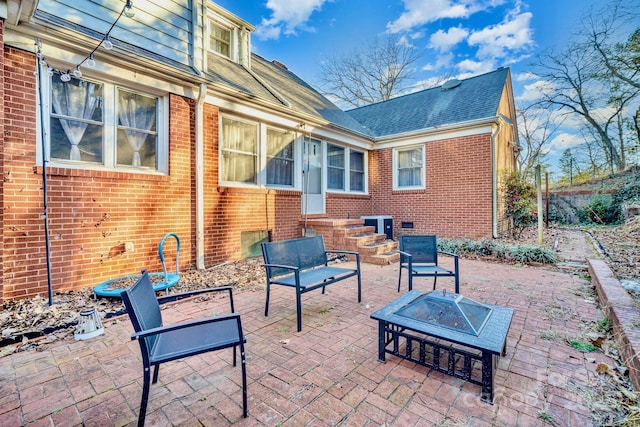 view of patio / terrace with an outdoor fire pit