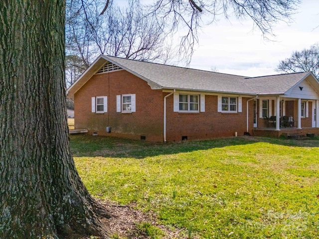 view of side of home featuring a yard