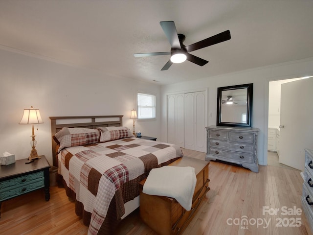 bedroom featuring ceiling fan, a closet, connected bathroom, and light hardwood / wood-style floors