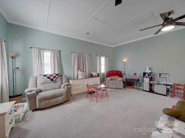 living room with light carpet, a healthy amount of sunlight, and crown molding