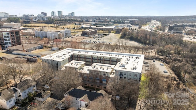 birds eye view of property featuring a view of city