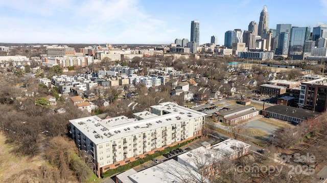 birds eye view of property with a view of city