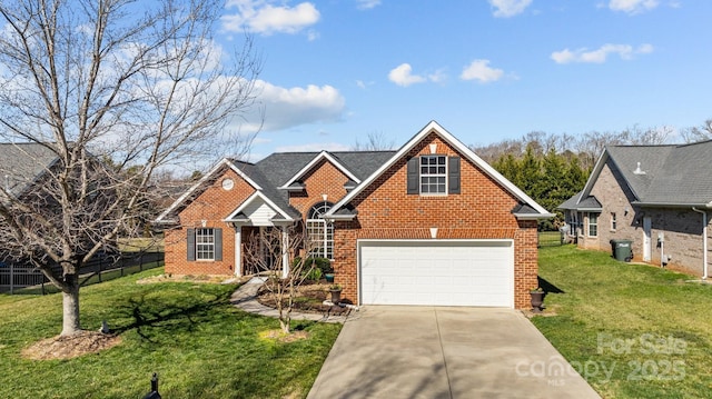 traditional home with driveway, a front yard, fence, and brick siding