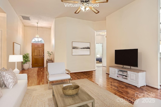 127 Lakewood Circle Dr, Mooresville, NC 28117 - living area featuring ceiling fan, wood finished floors, visible vents, and baseboards