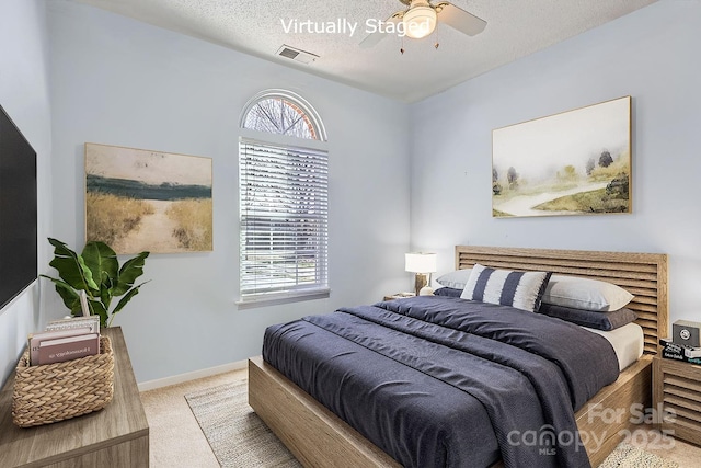 127 Lakewood Circle Dr, Mooresville, NC 28117 - bedroom featuring light colored carpet, visible vents, a textured ceiling, and multiple windows
