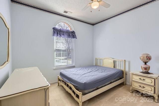 127 Lakewood Circle Dr, Mooresville, NC 28117 - bedroom featuring light carpet, multiple windows, visible vents, and a textured ceiling