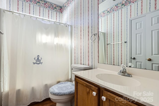 127 Lakewood Circle Dr, Mooresville, NC 28117 - full bathroom with toilet, wallpapered walls, shower / bath combo with shower curtain, and vanity