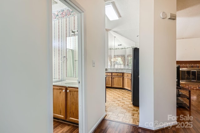 127 Lakewood Circle Dr, Mooresville, NC 28117 - interior space with a sink, parquet flooring, two vanities, visible vents, and baseboards
