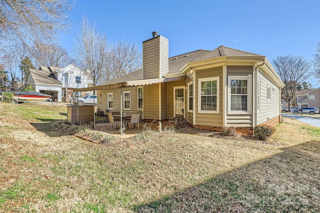 127 Lakewood Circle Dr, Mooresville, NC 28117 - back of house featuring a patio area, a chimney, and roof with shingles