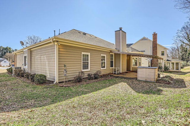 127 Lakewood Circle Dr, Mooresville, NC 28117 - back of house featuring a shingled roof, a chimney, a lawn, and a pergola